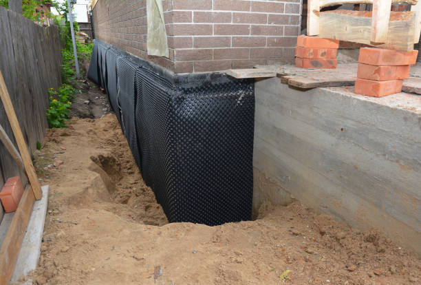 Happy homeowners after waterproofing job in Bringhurst